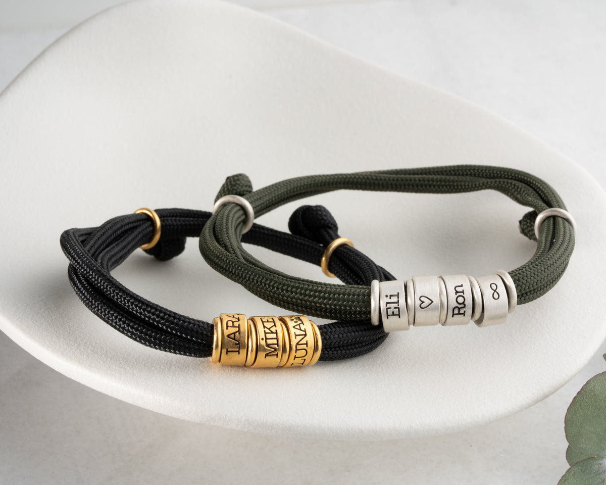 Men's paracord bracelet with personalized engraved beads, handmade by Artizian