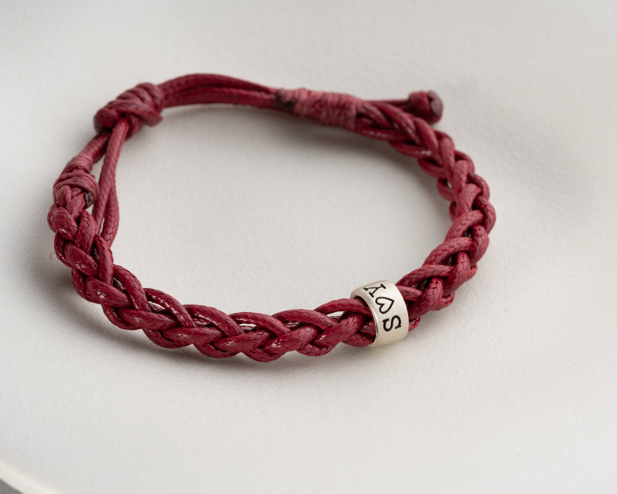 Women's hand-braided bracelet with personalized charms, Artizian handmade jewelry since 1999