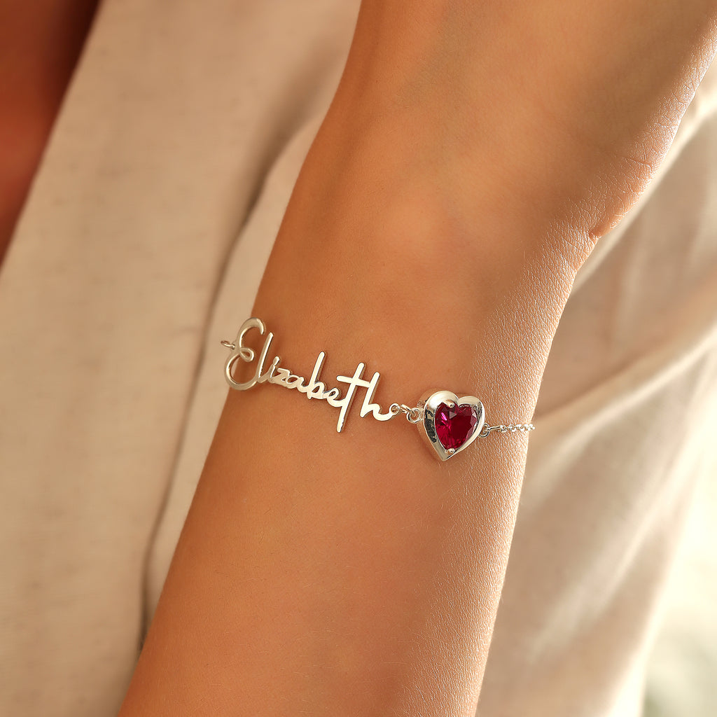 Heart charm birthstone name bracelet, crafted in the Artizian studio