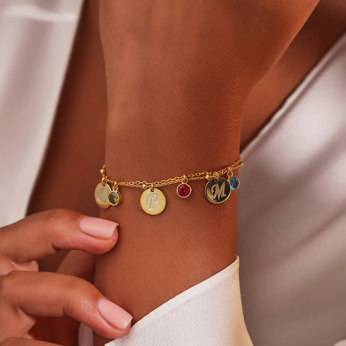 Custom birthstone bracelet with initials, crafted in the Artizian studio